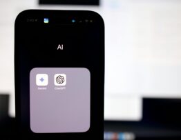 a close up of a cell phone with an ai button