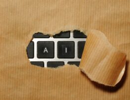 A piece of cardboard with a keyboard appearing through it