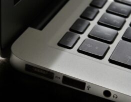 Free Detailed view of a silver laptop showing keyboard and multiple ports. Stock Photo